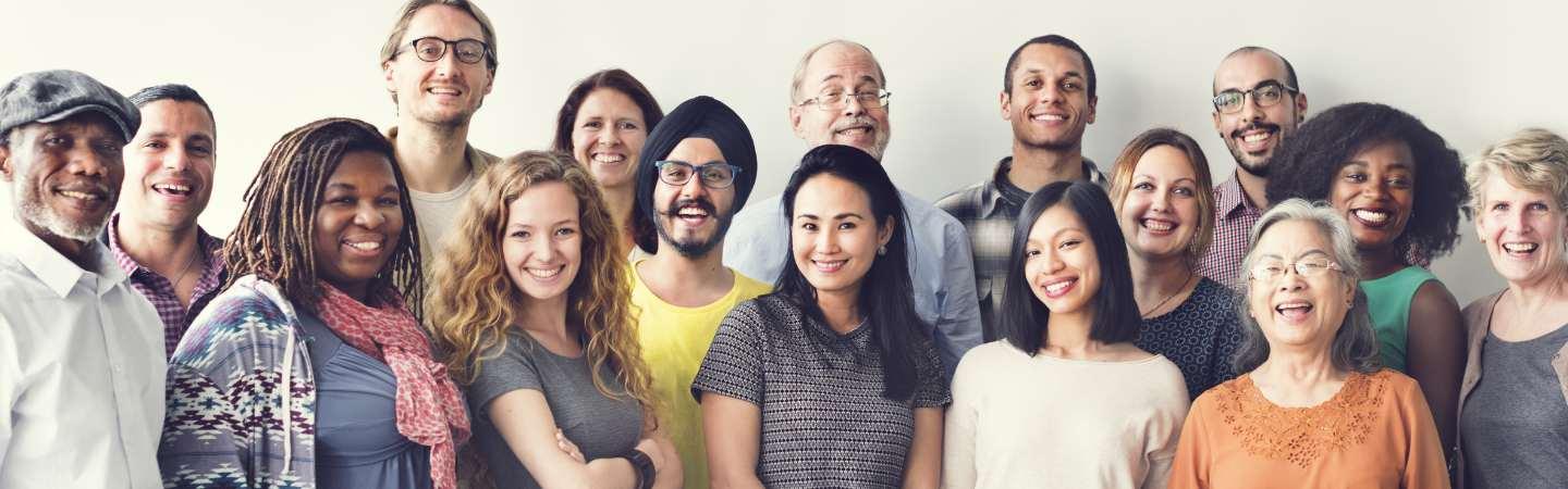 Staged photo of a group of people smiling at the camera