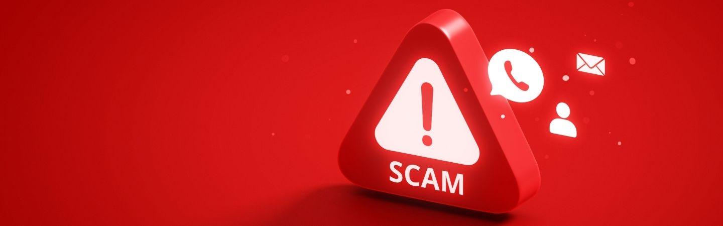 Image shows an a warning sign in red and the word 'scam' 