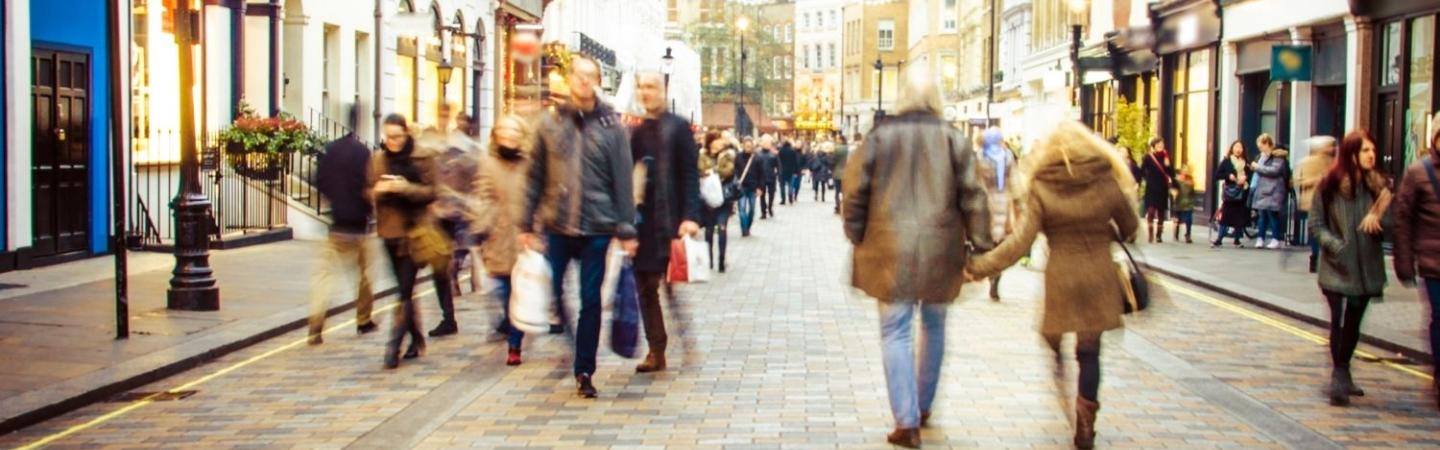 Image of people walking in a crowded town centre street